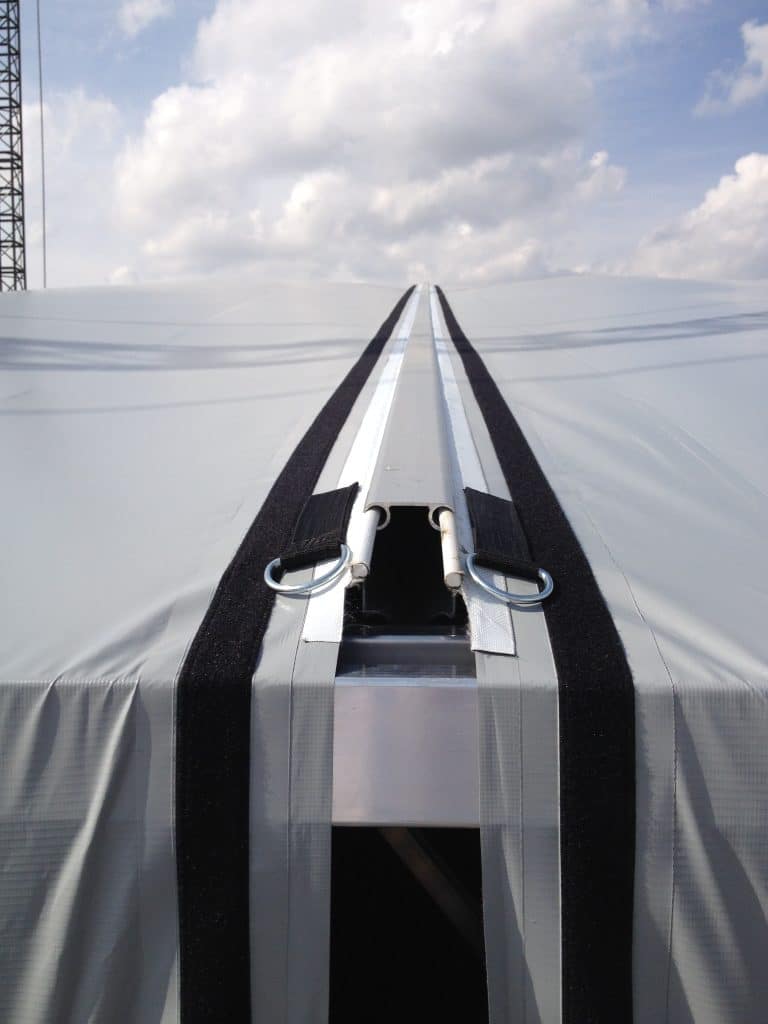 Close up of two, stock gray keder panels showing off how these panels fit into a central 2-sided keder rail.